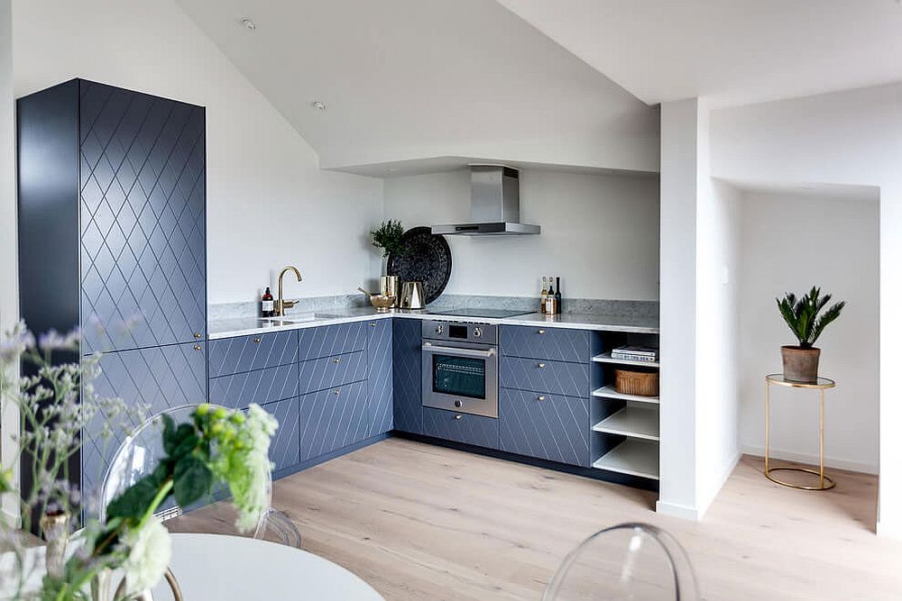 Brilliant-blue-patterened-cabinets-shape-this-brilliant-corner-kitchen-inside-the-Scandinavian-apartment